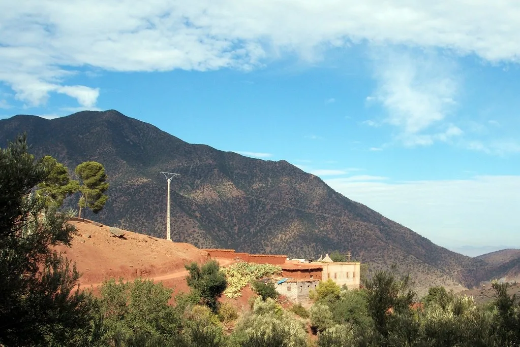 Traditional Berber farmhouse on a red hillside in the Asni Valley Traditional Berber farmhouse on a red hillside in the Asni Valley